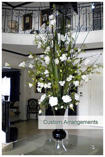 Custom floral arrangement using artificial plants and flower